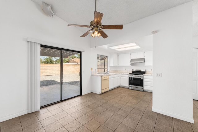 37756 E 45th St, Palmdale, CA 93552 - kitchen featuring gas stove, under cabinet range hood, dishwasher, light countertops, and light tile patterned floors