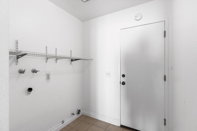 37756 E 45th St, Palmdale, CA 93552 - laundry room featuring gas dryer hookup, washer hookup, electric dryer hookup, light tile patterned flooring, and baseboards
