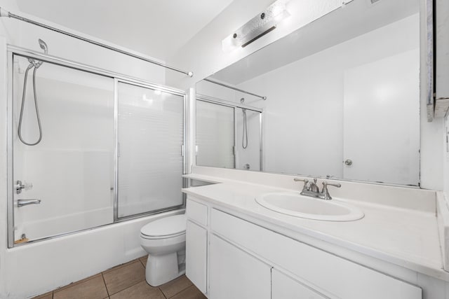 37756 E 45th St, Palmdale, CA 93552 - bathroom featuring toilet, vanity, bath / shower combo with glass door, and tile patterned flooring