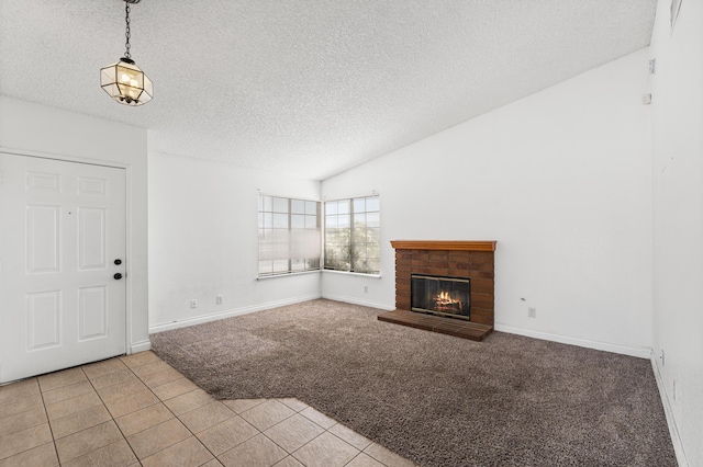 37756 E 45th St, Palmdale, CA 93552 - unfurnished living room featuring light colored carpet, a textured ceiling, a fireplace, light tile patterned floors, and baseboards