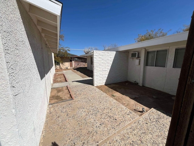 exterior space with an AC wall unit