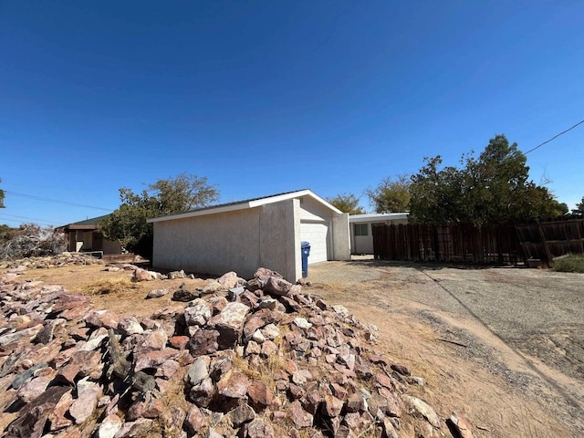 view of side of property with a garage