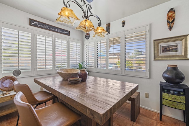 dining space with a healthy amount of sunlight and tile patterned floors