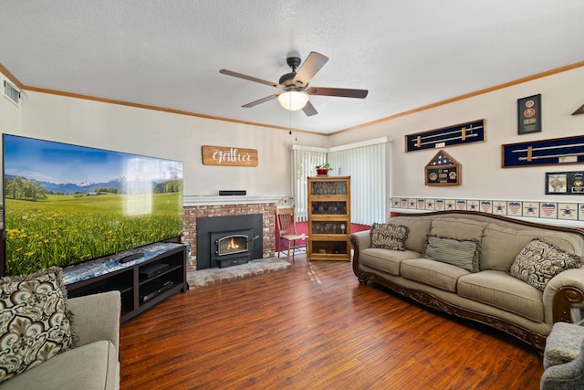 living room with a textured ceiling, ceiling fan, dark hardwood / wood-style floors, and crown molding