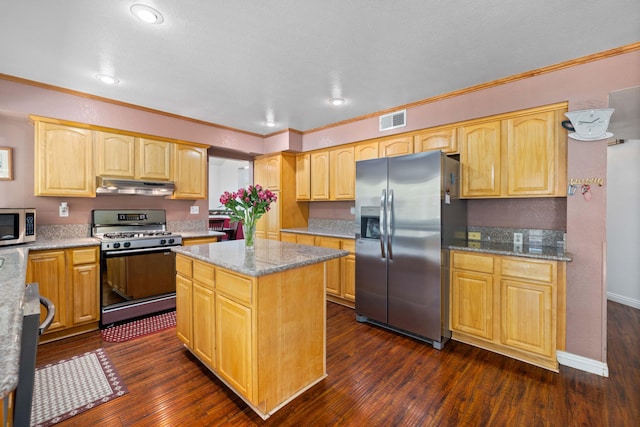 kitchen with light stone countertops, ornamental molding, a kitchen island, dark hardwood / wood-style flooring, and stainless steel appliances