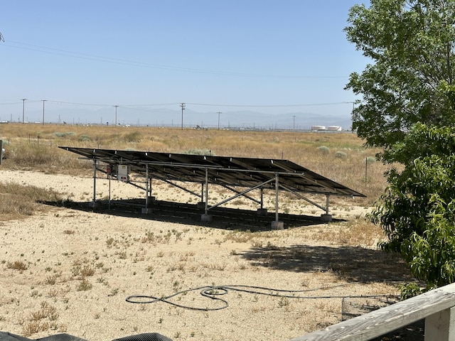 view of yard with a rural view