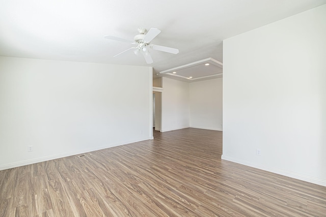 spare room with hardwood / wood-style flooring and ceiling fan