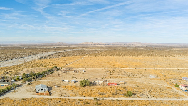 birds eye view of property with a rural view