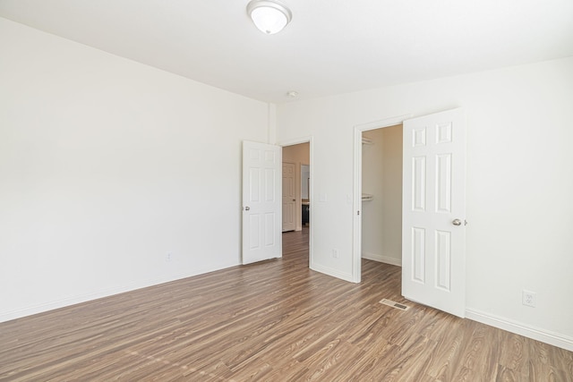 empty room featuring wood-type flooring