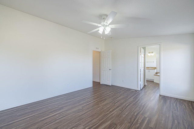 unfurnished room featuring ceiling fan and dark hardwood / wood-style flooring