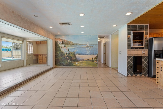 45503 Lorimer Ave, Lancaster, CA 93534 - kitchen featuring stainless steel refrigerator with ice dispenser, recessed lighting, a water view, light tile patterned floors, and open floor plan