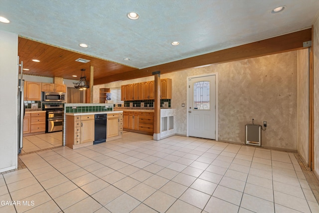 45503 Lorimer Ave, Lancaster, CA 93534 - kitchen featuring stainless steel appliances, light countertops, light brown cabinetry, recessed lighting, and light tile patterned flooring