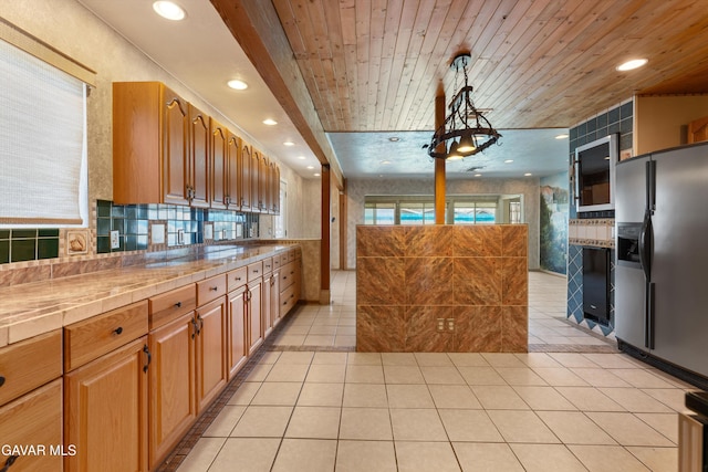 45503 Lorimer Ave, Lancaster, CA 93534 - kitchen featuring stainless steel refrigerator with ice dispenser, light tile patterned floors, recessed lighting, wood ceiling, and decorative backsplash