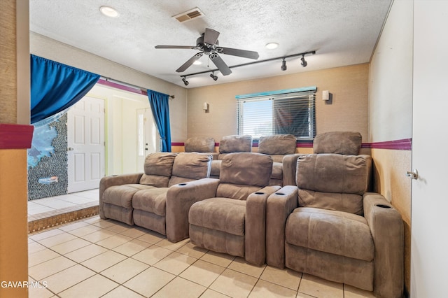45503 Lorimer Ave, Lancaster, CA 93534 - cinema with light tile patterned floors, a textured ceiling, a ceiling fan, and track lighting