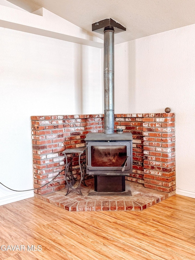 2895 59th St, Rosamond, CA 93560 - detailed view of wood finished floors and a wood stove