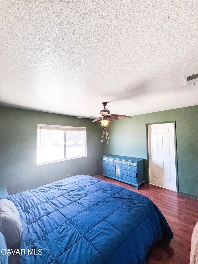 2895 59th St, Rosamond, CA 93560 - bedroom featuring wood finished floors, ceiling fan, and a textured ceiling