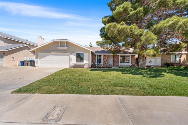 ranch-style home with a front lawn, a garage, concrete driveway, and brick siding