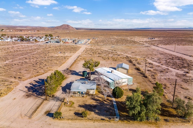 birds eye view of property featuring a mountain view