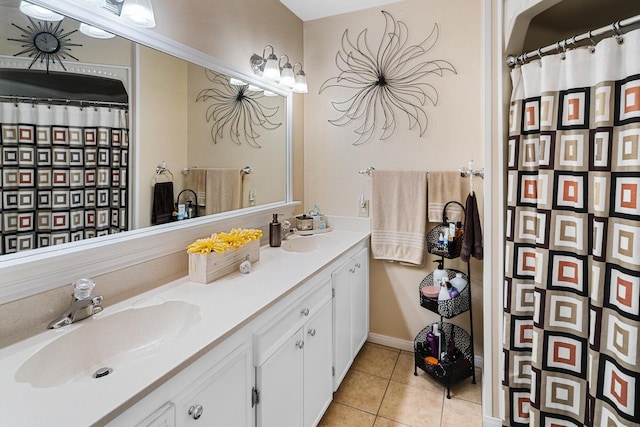 bathroom with tile patterned floors, curtained shower, and vanity