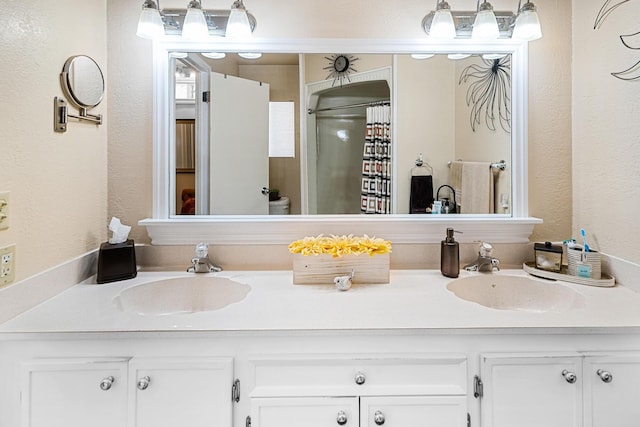 bathroom featuring vanity and walk in shower