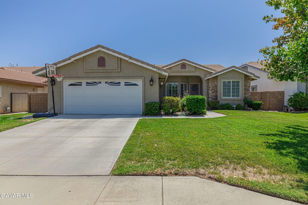 43156 W 28th St, Lancaster, CA 93536 - ranch-style home with an attached garage, concrete driveway, stucco siding, and stone siding