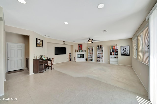 2354 Crimson Ave, Rosamond, CA 93560 - living room featuring light colored carpet, light tile patterned floors, a ceiling fan, recessed lighting, and built in shelves