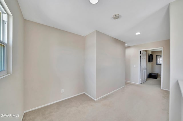 2354 Crimson Ave, Rosamond, CA 93560 - empty room featuring light colored carpet, a smoke detector, and recessed lighting
