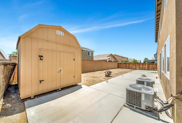 2354 Crimson Ave, Rosamond, CA 93560 - fenced backyard featuring a patio area and a storage unit
