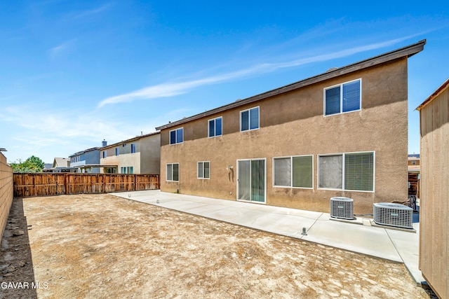 2354 Crimson Ave, Rosamond, CA 93560 - back of property with a fenced backyard, a patio, and stucco siding
