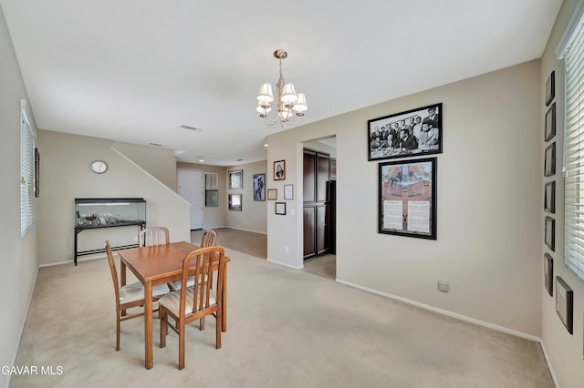 2354 Crimson Ave, Rosamond, CA 93560 - dining space featuring light colored carpet and a chandelier