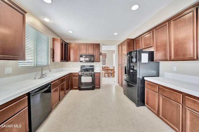 2354 Crimson Ave, Rosamond, CA 93560 - kitchen with black appliances, light countertops, recessed lighting, and brown cabinets