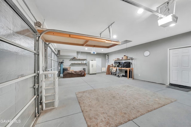 2354 Crimson Ave, Rosamond, CA 93560 - garage with freestanding refrigerator and a garage door opener