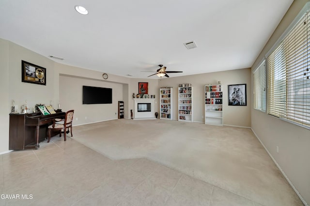 2354 Crimson Ave, Rosamond, CA 93560 - living room with a ceiling fan, light tile patterned floors, and light carpet