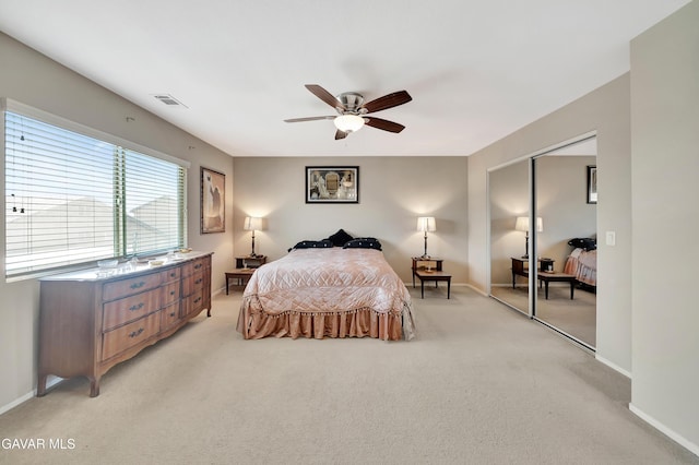 2354 Crimson Ave, Rosamond, CA 93560 - bedroom featuring light colored carpet, a closet, and a ceiling fan