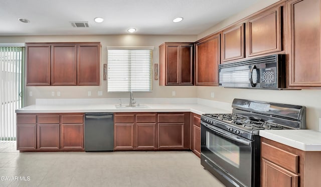 2354 Crimson Ave, Rosamond, CA 93560 - kitchen with black appliances, light countertops, light tile patterned floors, and recessed lighting