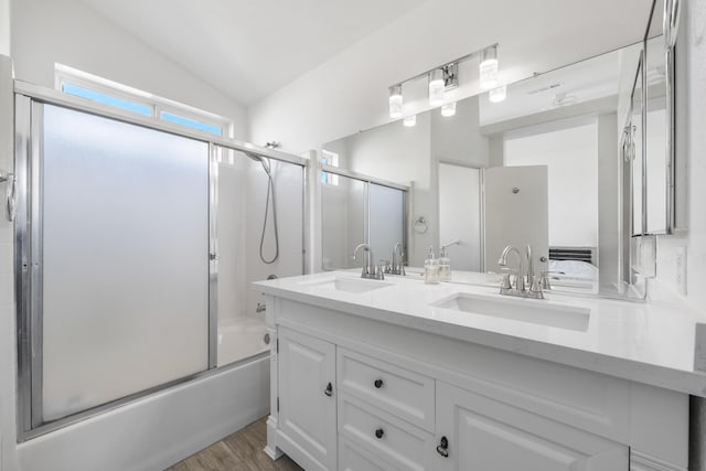 37116 Alder St, Palmdale, CA 93552 - full bath with bath / shower combo with glass door, double vanity, vaulted ceiling, and wood finished floors