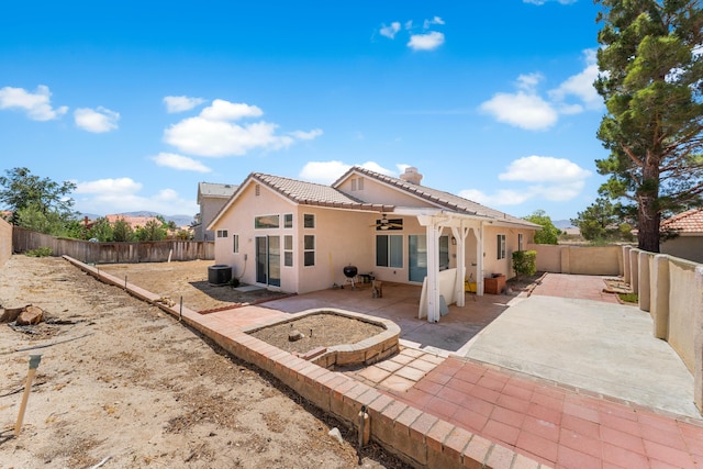 37116 Alder St, Palmdale, CA 93552 - back of property featuring a ceiling fan, stucco siding, a tiled roof, and a fenced backyard