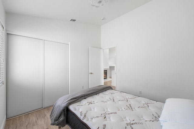 37116 Alder St, Palmdale, CA 93552 - bedroom featuring a closet, wood finished floors, and lofted ceiling