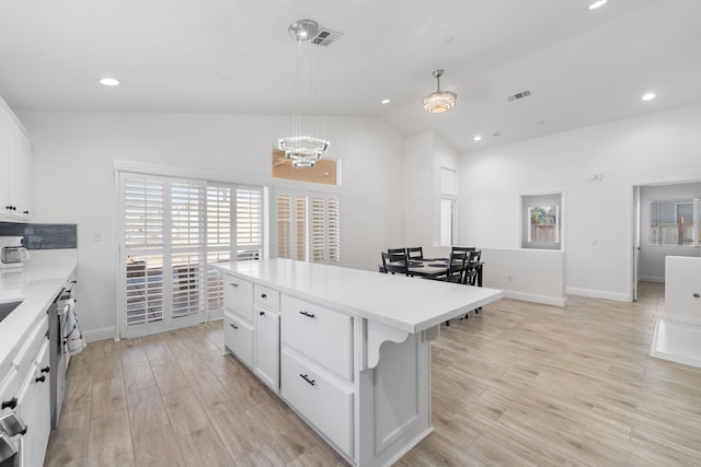 37116 Alder St, Palmdale, CA 93552 - kitchen featuring vaulted ceiling, light countertops, recessed lighting, light wood-type flooring, and a chandelier