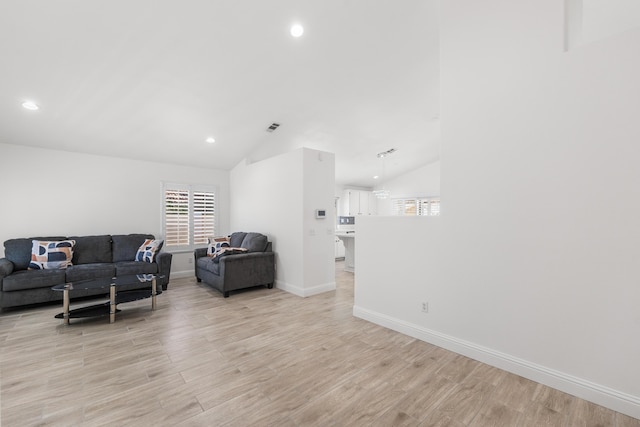 37116 Alder St, Palmdale, CA 93552 - living area with light wood-style flooring, lofted ceiling, healthy amount of natural light, recessed lighting, and baseboards
