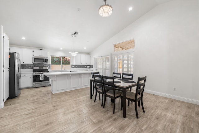 37116 Alder St, Palmdale, CA 93552 - dining area featuring light wood finished floors, recessed lighting, baseboards, and high vaulted ceiling
