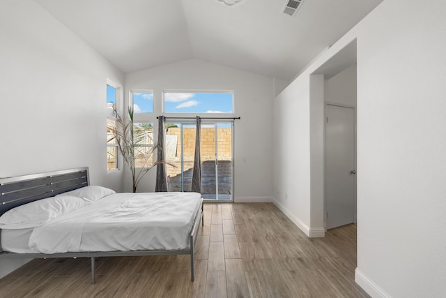 37116 Alder St, Palmdale, CA 93552 - bedroom featuring access to exterior, vaulted ceiling, wood finished floors, and baseboards