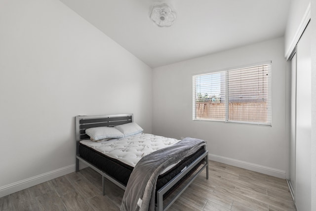 37116 Alder St, Palmdale, CA 93552 - bedroom featuring baseboards, wood finished floors, and lofted ceiling