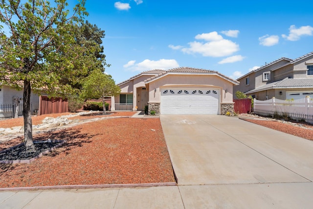37116 Alder St, Palmdale, CA 93552 - view of front of house featuring stone siding, an attached garage, stucco siding, concrete driveway, and a tile roof