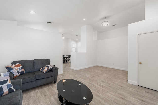 37116 Alder St, Palmdale, CA 93552 - living area featuring light wood-style flooring, baseboards, recessed lighting, and lofted ceiling