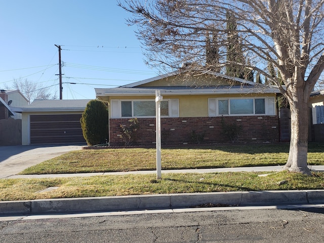 view of front of house featuring a garage and a front lawn