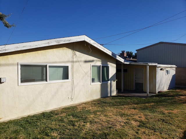 view of home's exterior with a yard