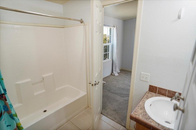 bathroom featuring tile patterned flooring, vanity, and shower / tub combo with curtain