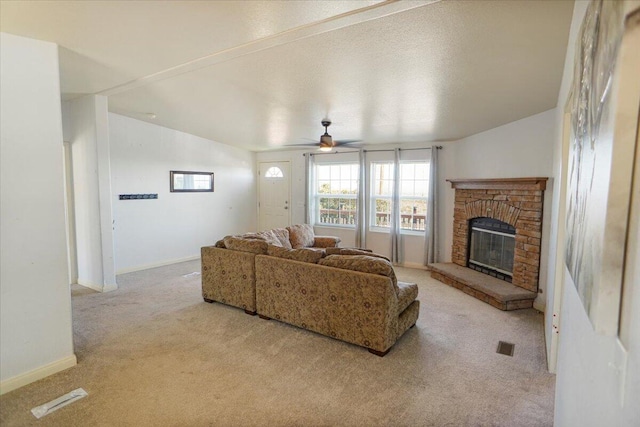 living room featuring ceiling fan, light carpet, and lofted ceiling