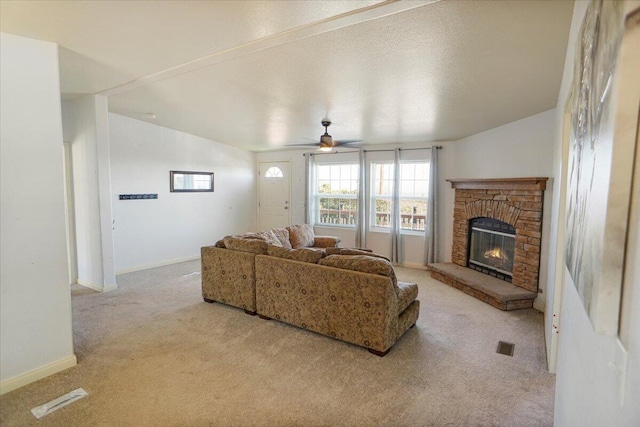 carpeted living room featuring vaulted ceiling and ceiling fan